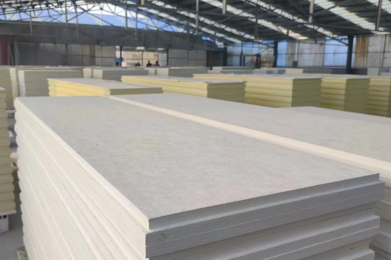 Warehouse stacked with finished fiberglass ceiling tiles ready for shipment